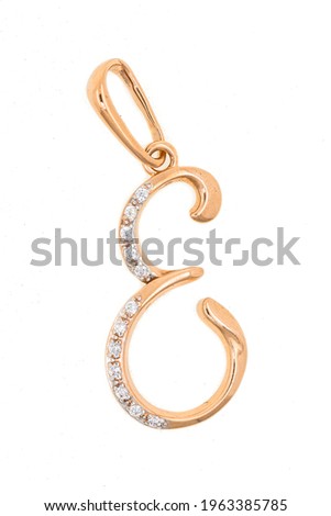 Gold pendant with diamonds in the form of an alphabet letter close-up. Jewelry, accessory isolated on white background.
