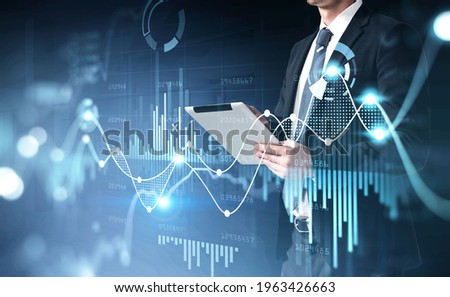 Office man using digital tablet, stock market changes, business graph bar chart. Double exposure of blue white white lines, growing numbers. Concept of online trading and technology