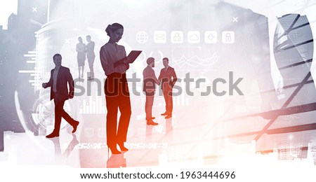 Office woman with tablet, business partners teamwork. Stock market changes and business bar chart blurred. Double exposure of skyscrapers and graphs. Concept of technology and finance