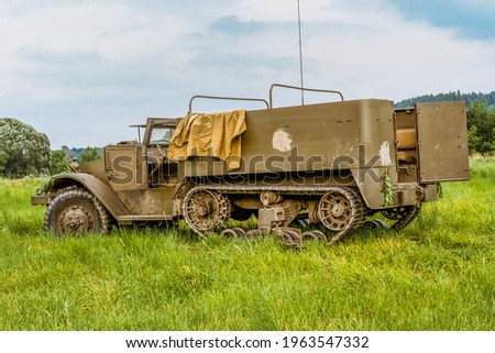 The M5 half-track (officially the Carrier, Personnel, Half-track, M5)  American armored personnel carrier in use during World War II. Reconnaissance and transport vehicle Royalty-Free Stock Photo #1963547332