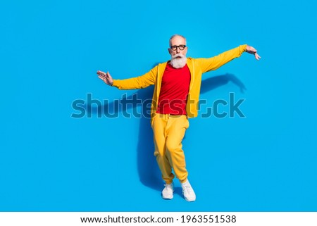 Full size photo of crazy funky funny silly grandfather dancing having fun fooling around isolated on blue color background