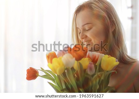female bouquet of tulips, portrait spring image of a girl and flowers