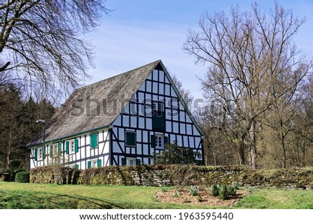 Sexton's house at the Kreuzkirche in Bergneustad-Wiedenest, Germany.
Typical mountain half-timbered house with green shutters. Royalty-Free Stock Photo #1963595440