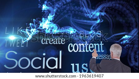 Composition of man touching virtual screen with social media text and light trails. global connections, data processing and technology concept digitally generated image.