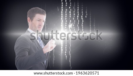 Composition of businessman touching virtual screen with glowing light and letters changing. global connections, data processing and technology concept digitally generated image.