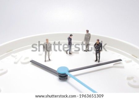 business man looking at watch and walk on the clock background, time business concept.