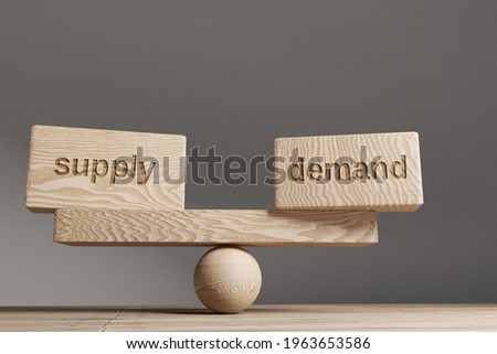 Supply and demand balance concept. Wooden cube block with words Supply and demand on seesaw. Royalty-Free Stock Photo #1963653586