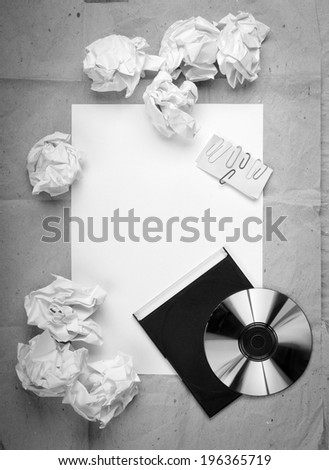 Creative work background with crumpled up paper, office objects and room for text