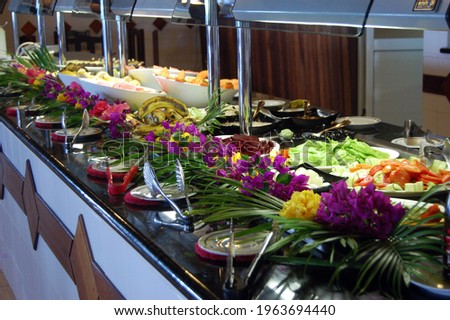 Tropical food buffet at a hotel resort Royalty-Free Stock Photo #1963694440