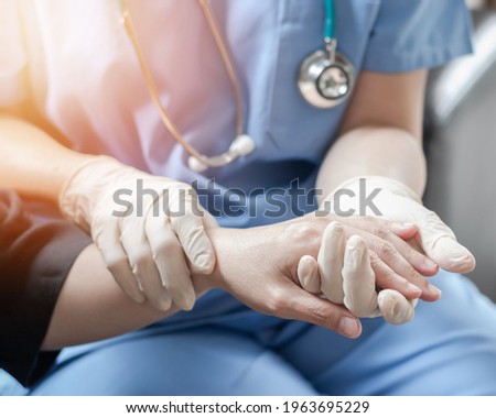 Surgeon, surgical doctor, anesthetist or anesthesiologist holding patient's hand for health care trust and support in professional ER surgical operation, medical anesthetic safety, healthcare concept Royalty-Free Stock Photo #1963695229