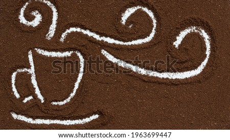 View from above. Ground coffee. Drawing of a coffee cup with aromatic smoke. Coffee love concept