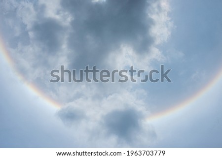 The sky with clouds and rainbow lights