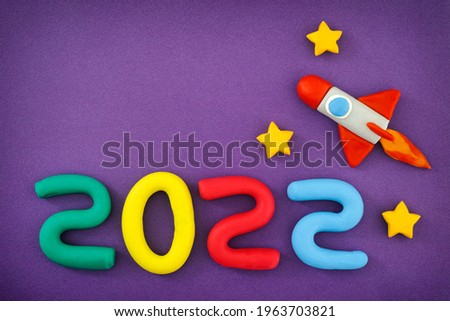 The New Year 2022. The space rocket and Numbers are made out of play clay (plasticine).