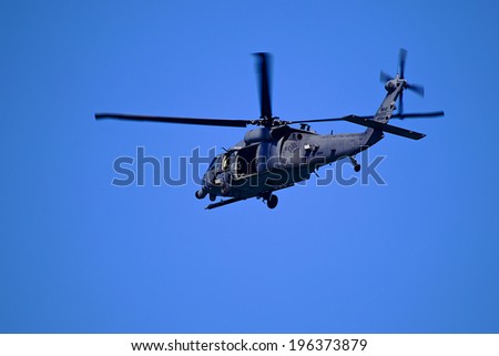 Military Helicopter Picture of a military helicopter flying over the Atlantic Ocean.