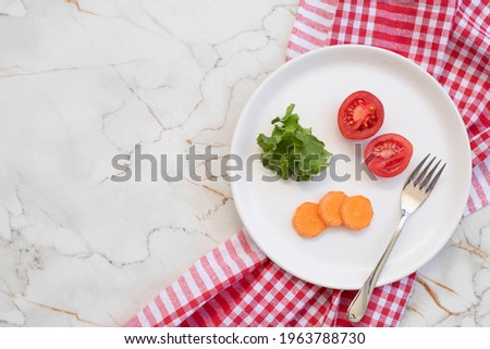 Small portion of food on big plate on white table, top view Royalty-Free Stock Photo #1963788730