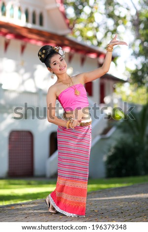 Thai dancing girl with northern style dress in temple, Chiang Mai, Thailand