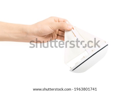 Hands hold white boat on white isolate. Template for designers