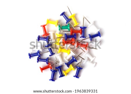 Push pins isolated on white background. Colourful push-pin thumbtack tools office on white background.  Royalty-Free Stock Photo #1963839331