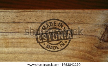Made in Estonia stamp printed on wooden box. Factory, manufacturing and production country concept.
