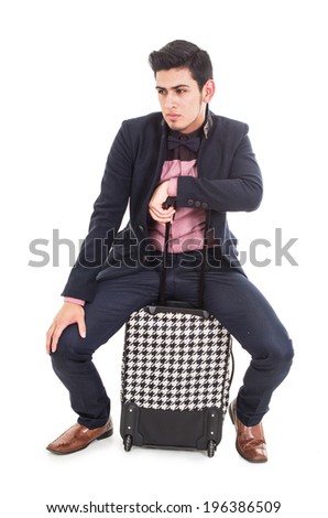man with a suitcase waiting on a white background