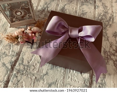 gift box with ribbon and flower