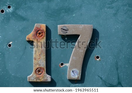 old rusty numbers on mailbox