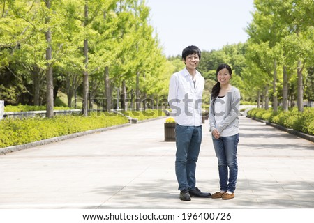 Asian couple of serious look
