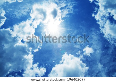 Blue sky with clouds and sun. Royalty-Free Stock Photo #196402097