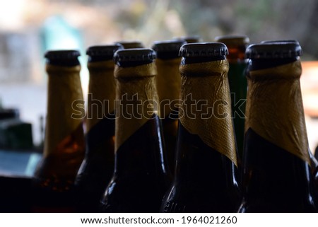 Close up picture of glass bottle and iron cap on it. Background Blur