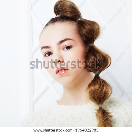 Beautiful little fashion model on white background. Portrait of cute smiling girl posing in studio