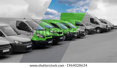 Delivery vans in a row. The band makes them green. Clean transportation concept Royalty-Free Stock Photo #1964028634