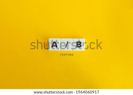 AB testing banner and concept. Block letters on bright orange background. Minimal aesthetics.