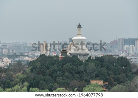 Overlooking the city skyline and white tower in Beihai Park in Beijing, China