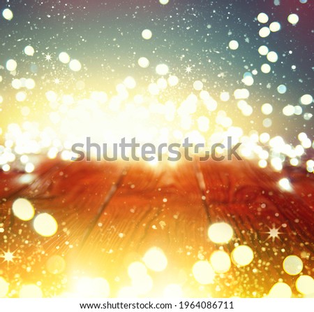 Holiday background with bokeh and  wooden table with christmas light