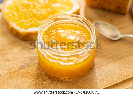 Jar with freshly making citrus jam. Selective focus. Shallow depth of field.