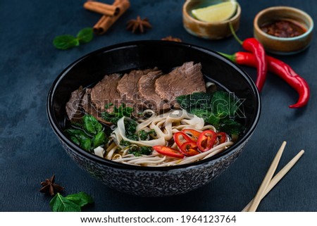 pho bo soup with beef, Pho bo Vietnamese food, rice noodle soup with sliced beef. Vietnamese fresh rice noodle soup with beef. Vietnam's national dish Royalty-Free Stock Photo #1964123764