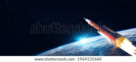 Launch the space shuttle into open space above planet Earth. Elements of this image furnished by NASA