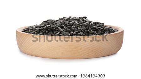 Plate of sunflower seeds isolated on white