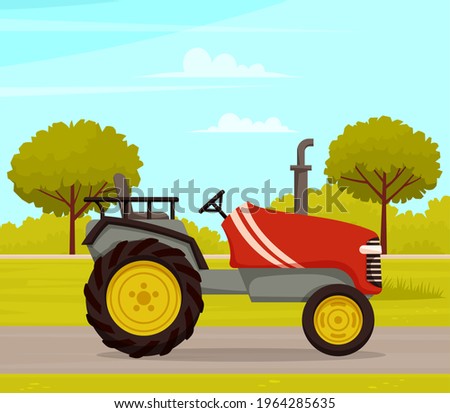 Driving tractor on road near meadow on nature landscape. Driving red tractor, agrimotor cabin. Agriculture driver profession harvesting and cultivation in summer in countryside