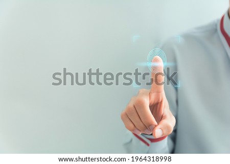 Fingerprint scan provides security access with biometrics identification. Business Technology Safety Internet Network Concept,copy space for text. Royalty-Free Stock Photo #1964318998