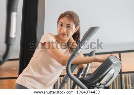 Workout woman, girl, exercise on elliptical trainer in fit sportswear, practice working out training for health. Sport strong person in gym fitness for healthy lifestyle, recreation concept.