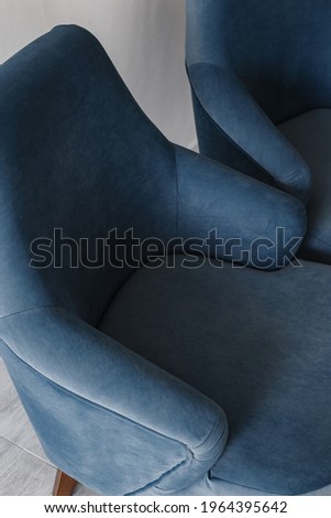 Blue, cornflower, dark blue color armchair. Modern designer armchair. Parts of the chair. Back, armrests and seat. Textile armchair. Series of furniture. Royalty-Free Stock Photo #1964395642