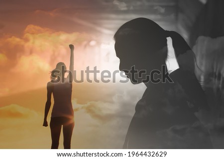 young woman getting over her sadness, and fear, and feeling rejuvenated and empowered Royalty-Free Stock Photo #1964432629