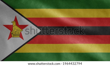 Zimbabwean flag waving in the wind. Close up of Zimbabwe banner blowing, soft and smooth silk. Cloth fabric texture ensign background.