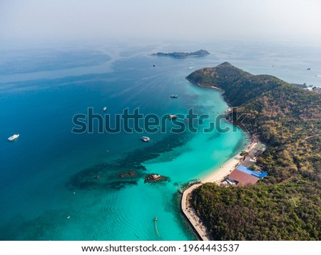 Aerial view or top view from drone camera of beautiful landscape mountain and blue sea in Koh larn island,Pattaya city Thailand,seascape and nature background. Sea wallpaper.