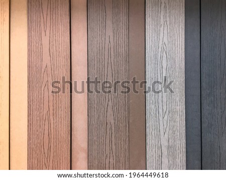 Close up of the multicolor artificial wood wall for creative design and reduce global warming background
