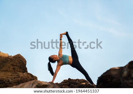 Asian woman practicing yoga on  on the mountain . wellness, healthcare, sport and lifestyle concept.