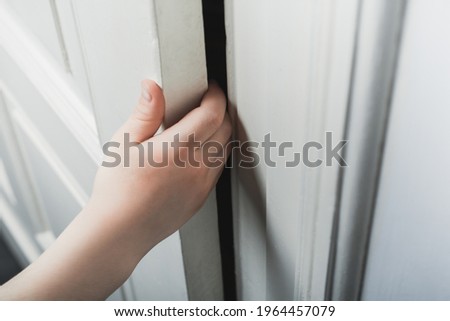 Child Fingers From Being Bruised Without Door Stopper Protection - Prevent Child Hazard Concept Royalty-Free Stock Photo #1964457079
