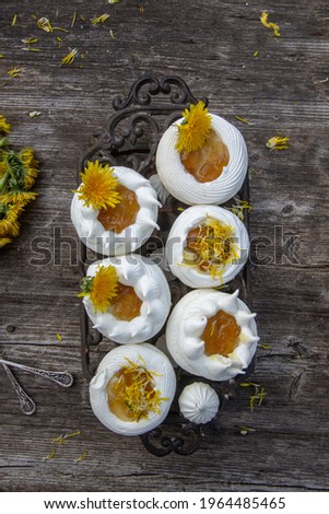 Anna Pavlova cake with lemon curd and dandelion syrup