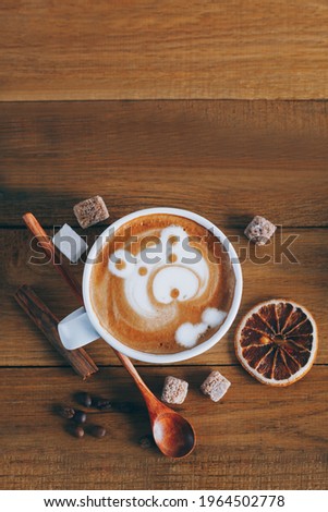 Latte art. Teddy bear made of coffee foam and milk